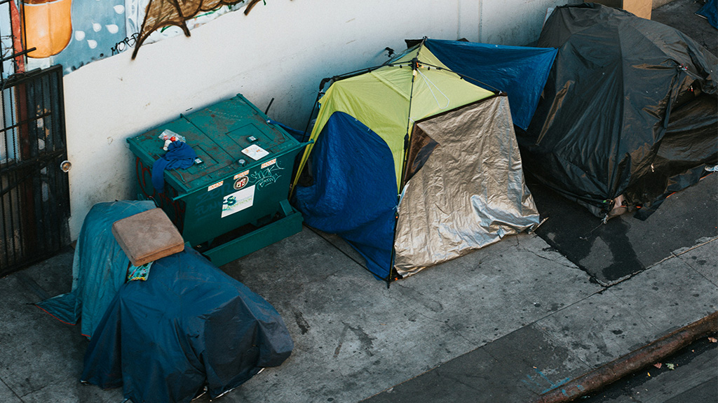Photo: blue and green plastic camping tents; Source: Photo by Nathan Dumlao on Unsplash, https://unsplash.com/photos/blue-and-green-plastic-trash-bins-i__uqGnARyI