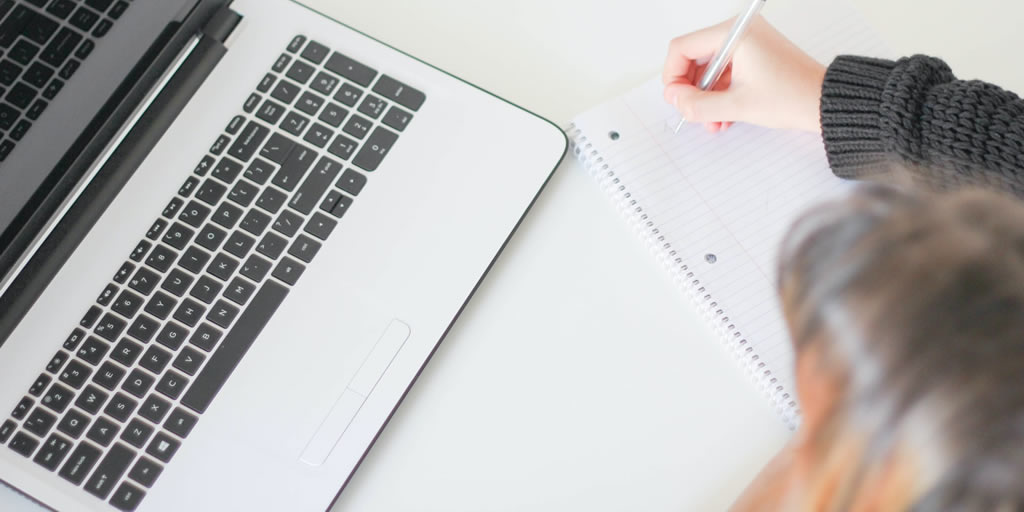Photo: Student with laptop - from Unsplash