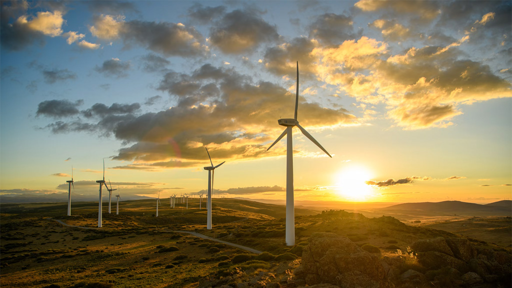 Windmills on a hill at sunset. Photo by Matteo del Piano on Unsplash https://unsplash.com/photos/a-group-of-windmills-on-a-hill-at-sunset-DGqnrmdQimo